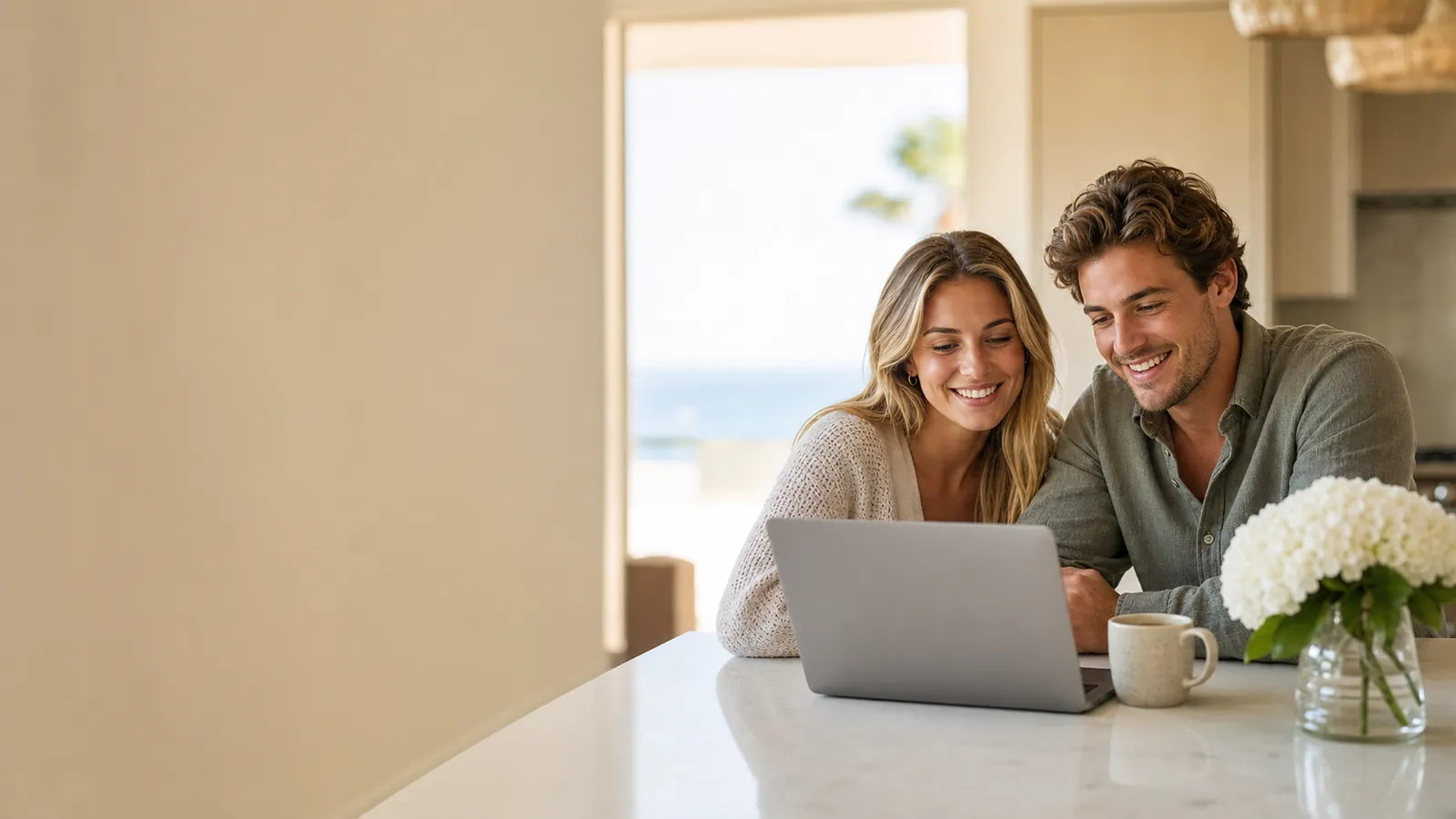 San Diego couple booking Coastal Maid cleaning services online at a clean kitchen island